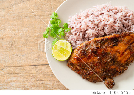 spicy grilled Jamaican jerk chicken with rice 110515459