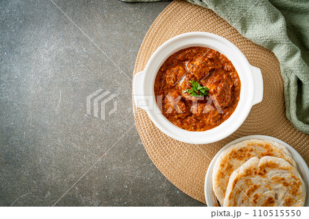 chicken tikka masala spicy curry meat food with roti or naan bread 110515550