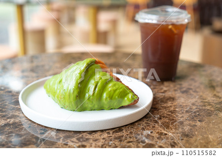 matcha green tea croissant on plate matcha green tea croissant on plate 110515582