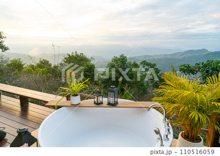 outdoor bath tub with beautiful mountain view background 110516059