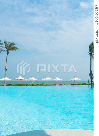 umbrella with bed pool around swimming pool with ocean sea background umbrella with bed pool around swimming pool with ocean sea background 110516167
