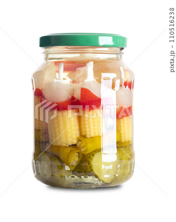 Party skewers, with pickled vegetables, in a glass jar, with screw cap. Pickled vegetables on plastic skewers. Pearl onions, red bell peppers, baby corn, green chilis and gherkins. Front view. Photo. 110516238