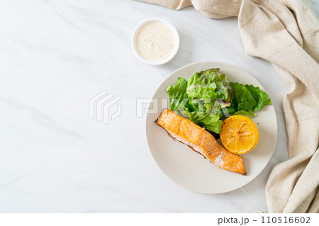 fried salmon steak with lemon and vegetable fried salmon steak with lemon and vegetable 110516602