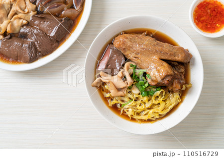 egg noodles with stewed and braised duck in brown soup egg noodles with stewed and braised duck in brown soup 110516729
