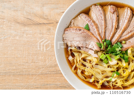 egg noodles with stewed duck in brown soup egg noodles with stewed duck in brown soup 110516730