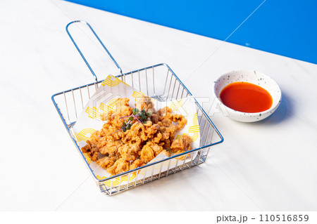 deep fried chicken skin with sauce 110516859