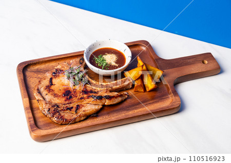 grilled pork chop steak with spicy jaew sauce grilled pork chop steak with spicy jaew sauce 110516923
