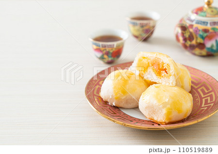 Chinese pastry moon cake with salted egg peanut or Spring Roll pastry with nuts and salted eggs 110519889