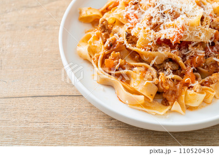 Homemade pasta fettuccine bolognese with cheese Homemade pasta fettuccine bolognese with cheese 110520430