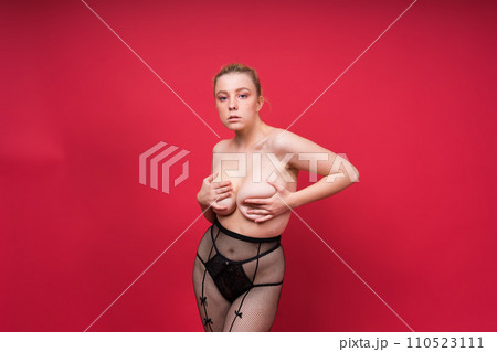 Seductive attractive blonde woman posing in fashionable lingerie in studio Seductive attractive blonde woman posing in fashionable lingerie in studio 110523111