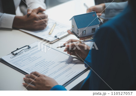 Real estate agent and customer signing contract to buy house, insurance or loan real estate.rent a house,get insurance or loan real estate or property. Real estate agent and customer signing contract to buy house, insurance or loan real estate.rent a house,get insurance or loan real estate or property. 110527057