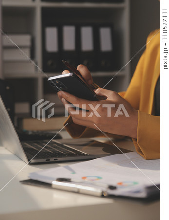 Close up of Business team analyzing income charts and graphs with modern laptop computer. Business analysis and strategy concept. Close up of Business team analyzing income charts and graphs with modern laptop computer. Business analysis and strategy concept. 110527111