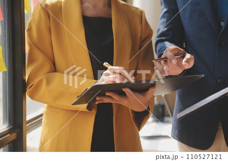 Close up of Business team analyzing income charts and graphs with modern laptop computer. Business analysis and strategy concept. 110527121