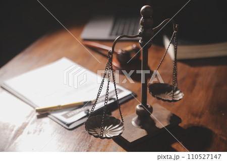 image of judge's hammer, scales lady of justice, law book, laptop computer and contract documents with pen concept of law and justice. 110527147