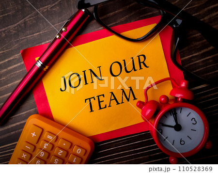 Top view calculator,pen,clock and glasses with text JOIN OUR TEAM on wooden background. 110528369