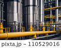 Equipment and piping inside of modern industrial petrochemical power plant for gas or oil industry. Oil refinery plant from industry, pipe line steel close up. AI 110529016