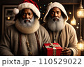 Two African American Santa Clauses stands with gift box, close portrait. Dark skinned man wearing in Santa suit with gift box on Christmas background full of Christmas goodies. AI 110529022