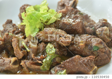 steamed pork bone with black sweet soy sauce topping celery on plate 110530450