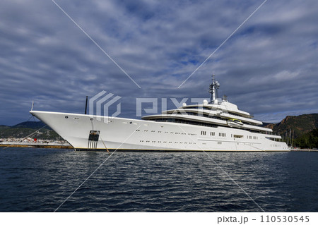 Luxury super yacht moored alongside in marina. Motor yacht. Large mega yacht. Yachting concept. Luxury super yacht moored alongside in marina. Motor yacht. Large mega yacht. Yachting concept. 110530545