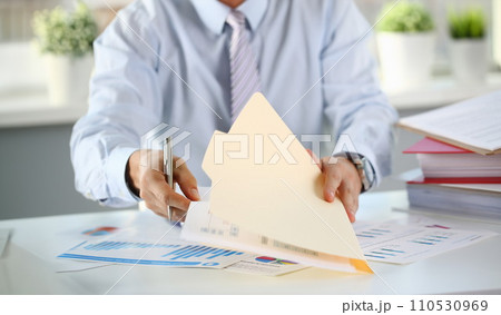 Male hands hold documents with financial 110530969