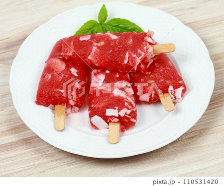 Homemade ice lolly from water melon with almond pieces 110531420