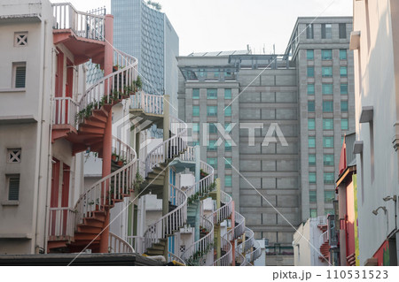 Closeup colorful exterior spiral staircases of shophouse, Singapore Closeup colorful exterior spiral staircases of shophouse, Singapore 110531523