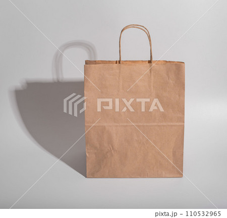 Beige brown kraft paper bag with shadow 110532965