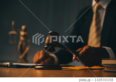 Judge gavel with Justice lawyers having team meeting at law firm background. Concepts of Law and Legal services. Judge gavel with Justice lawyers having team meeting at law firm background. Concepts of Law and Legal services. 110533158