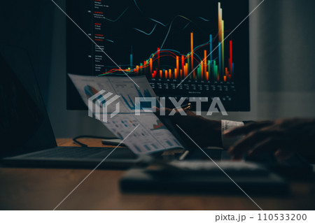 Thoughtful focused successful caucasian male stock investor, broker, financial adviser, sits at work desk, looks at computer, pensively analyze risks and prospects, rise or fall of cryptocurrency coin 110533200