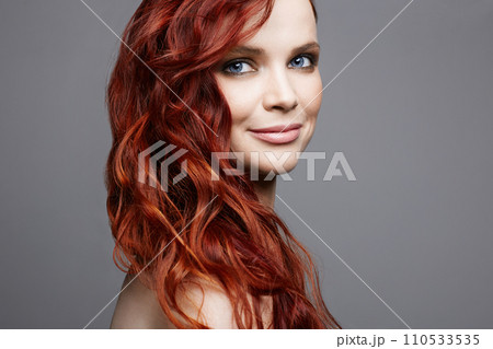 beautiful smiling woman with curly red hair. beauty portrait beautiful smiling woman with curly red hair. beauty portrait 110533535