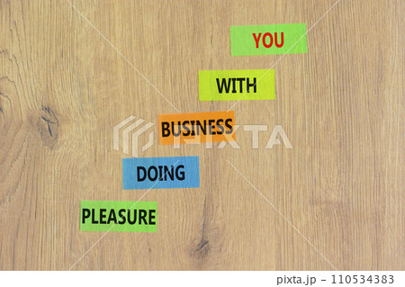 Pleasure doing business with you symbol. Concept words Pleasure doing business with you on colored paper. Beautiful wooden background. Pleasure doing business with you concept. Copy space. 110534383