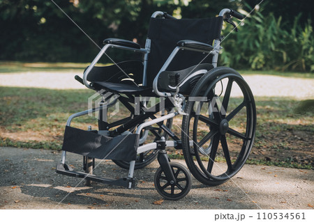 Single wheelchair parked in hospital hallway 110534561