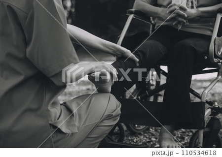 young asian physical therapist working with senior woman on walking with a walker young asian physical therapist working with senior woman on walking with a walker 110534618