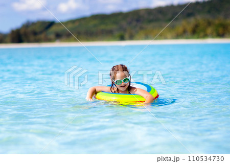 Child on tropical beach. Sea vacation with kids. Child on tropical beach. Sea vacation with kids. 110534730
