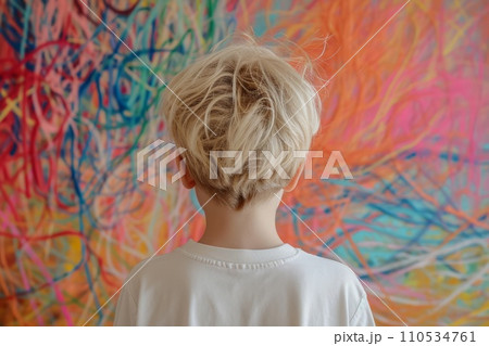 A boy standing with his back to us against a background of multi-colored tangled threads, the concept of neurodiversity and adhd problems A boy standing with his back to us against a background of multi-colored tangled threads, the concept of neurodiversity and adhd problems 110534761