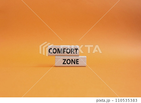 Comfort zone symbol. Concept word Comfort zone on wooden blocks. Beautiful orange background. Business and Comfort zone concept. Copy space 110535383
