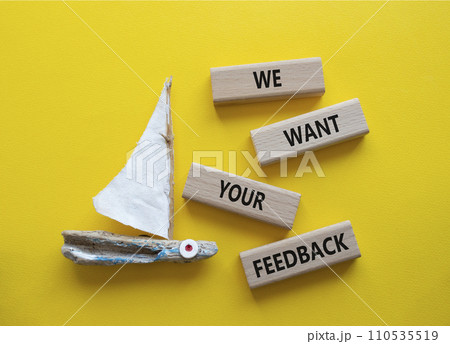 We want your feedback symbol. Wooden blocks with words We want your feedback. Beautiful yellow background with boat. We want your feedback concept. Copy space. 110535519
