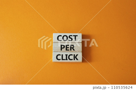 Cost Per Click symbol. Concept word Cost Per Click on wooden cubes. Beautiful orange background. Business and Cost Per Click concept. Copy space. Cost Per Click symbol. Concept word Cost Per Click on wooden cubes. Beautiful orange background. Business and Cost Per Click concept. Copy space. 110535624