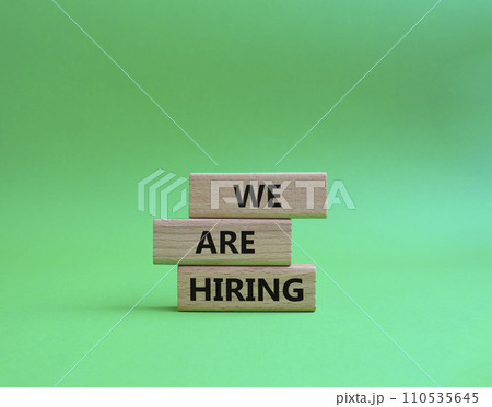 We are Hiring symbol. Concept words We are Hiring on wooden blocks. Beautiful green background. Business and We are Hiring concept. Copy space. We are Hiring symbol. Concept words We are Hiring on wooden blocks. Beautiful green background. Business and We are Hiring concept. Copy space. 110535645