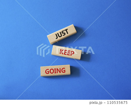 Just keep going symbol. Concept words Just keep going on wooden blocks. Beautiful blue background. Business and Just keep going concept. Copy space. Just keep going symbol. Concept words Just keep going on wooden blocks. Beautiful blue background. Business and Just keep going concept. Copy space. 110535675