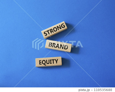 Strong Brand Equity symbol. Concept words Strong Brand Equity on wooden blocks. Beautiful blue background. Business and Strong Brand Equity concept. Copy space Strong Brand Equity symbol. Concept words Strong Brand Equity on wooden blocks. Beautiful blue background. Business and Strong Brand Equity concept. Copy space 110535680