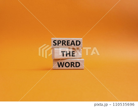 Spread the Word symbol. Concept words Spread the Word on wooden blocks. Beautiful orange background. Business and Spread the Word concept. Copy space. 110535696