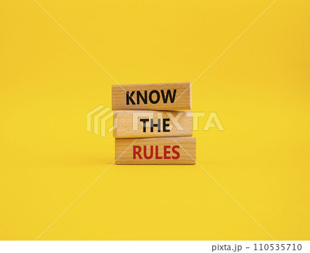 Know the rules symbol. Wooden blocks with words Know the rules. Beautiful yellow background. Business and Know the rules concept. Copy space. 110535710