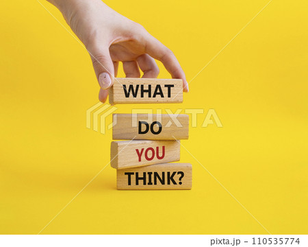 What do you think symbol. Wooden blocks with words What do you think. Businessman hand. Beautiful yellow background. Business and What do you think concept. Copy space. 110535774