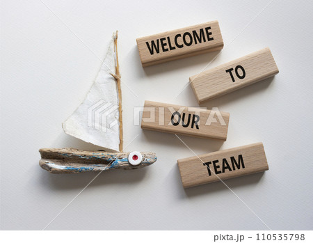 Welcome to our team symbol. Concept words Welcome to our team on wooden blocks. Beautiful white background with boat. Business and Welcome to our team concept. Copy space. 110535798