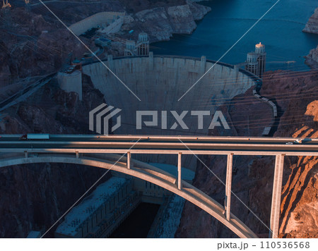 Hoover Dam on the Colorado River straddling Nevada and Arizona at dawn from above. Aerial view of Hoover Dam and the Colorado River Bridge Hoover Dam on the Colorado River straddling Nevada and Arizona at dawn from above. Aerial view of Hoover Dam and the Colorado River Bridge 110536568