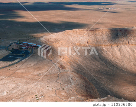 Aerial view of the Meteor Crater Natural Landmark at Arizona. Crater from a meteorite, from space. Elements of this image furnished by NASA. High quality photo Aerial view of the Meteor Crater Natural Landmark at Arizona. Crater from a meteorite, from space. Elements of this image furnished by NASA. High quality photo 110536580