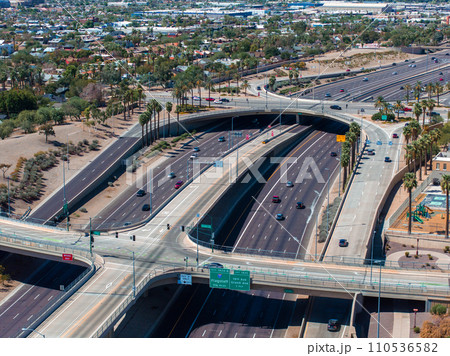 Aerial view of the highway and crossroads intersections in Phoenix, USA. Top up aerial drone view of elevated road and traffic junctions in USA metropolis during sunny day. 110536582