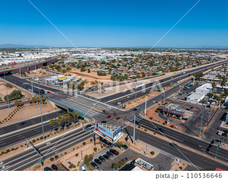 Aerial view of the highway and crossroads intersections in Phoenix, USA. Top up aerial drone view of elevated road and traffic junctions in USA metropolis during sunny day. 110536646