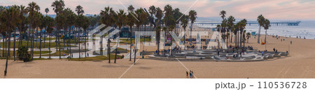 Skate board park in Venice beach with people skating by the Pacific ocean. Best and most popular skate park in the world. 110536728